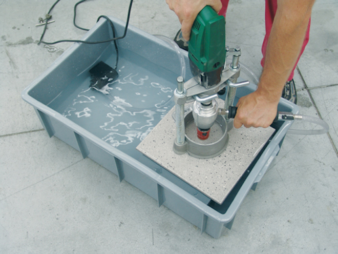 drilling a hole in a tile with a diamond core bit